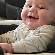 Zane joined the competition — help win amazing prizes! baby, cheeks, child, close_up, comfort, cozy, cute, face, furniture, happy, high_chair, indoors, infant, onesie, person, portrait, sitting, skin, smiling, young_child