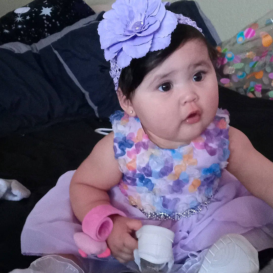 Irie is registered to the contest to win money with this photo: baby, baby_toddler_clothing, blue, cap, cheek, child, fashion_accessory, fun, hair_accessory, happy, headgear, headpiece, headwear, iris, pattern, person, pink, purple, skin, toddler