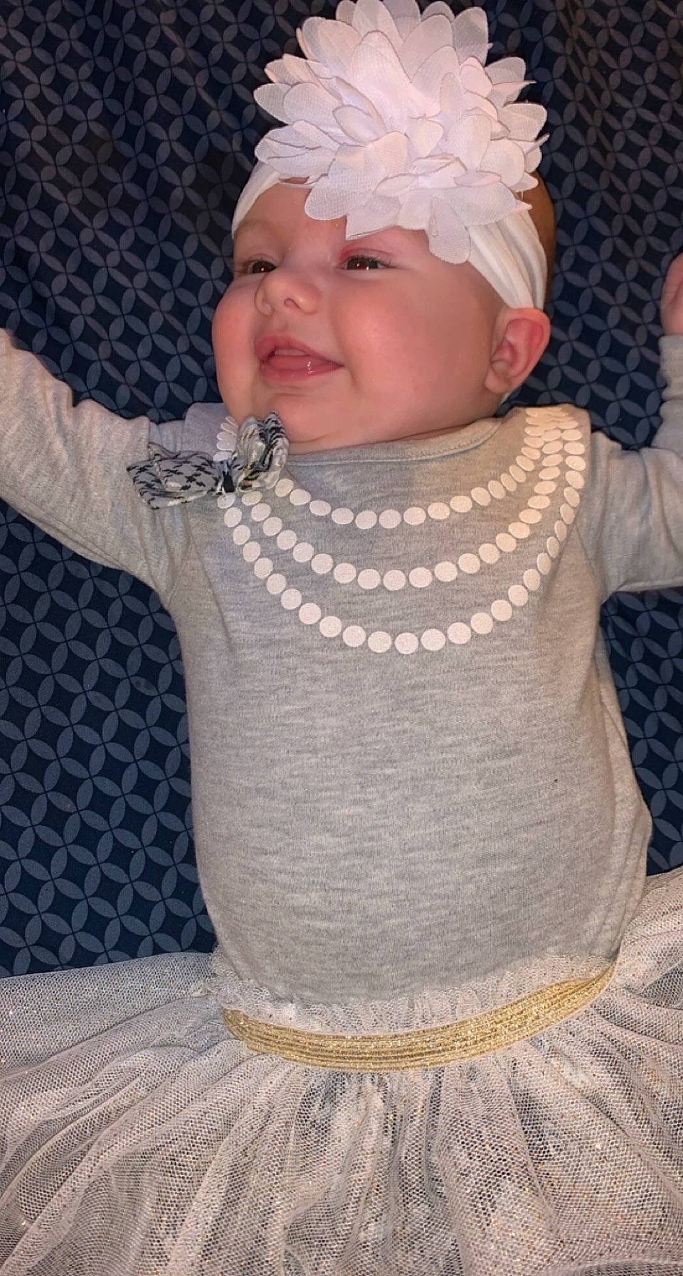 Kara is registered to the contest to win money with this photo: art, baby, baby_toddler_clothing, cheek, child, chin, embellishment, fashion_accessory, hairstyle, happy, headgear, headwear, jewellery, lip, pattern, person, pink, skin, sleeve, smile