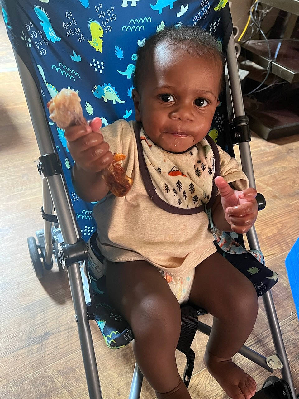 Tyrell is registered to the contest to win money with this photo: baby, baby_carriage, baby_products, baby_toddler_clothing, blue, chair, eye, face, finger, fun, happy, head, leg, leisure, person, product, skin, thigh, tire, toddler