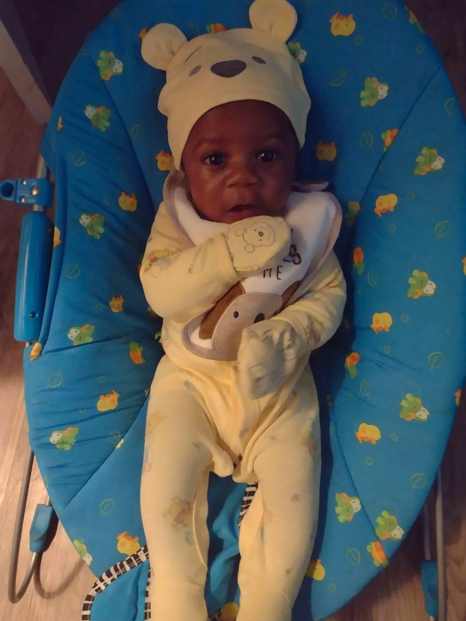 Tyrell is registered to the contest to win money with this photo: baby, baby_products, baby_safety, baby_sleeping, baby_toddler_clothing, cap, cheek, child, comfort, face, finger, hand, human_body, linens, outerwear, person, skin, sleeve, smile, textile