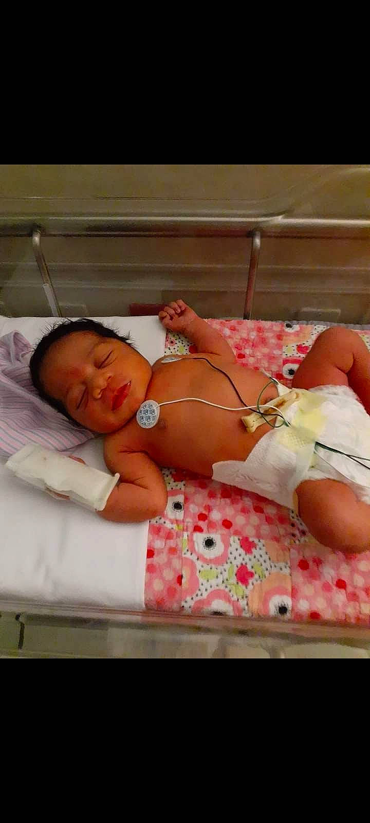 Jeliyah joined the competition — help win amazing prizes! abdomen, baby, baby_sleeping, baby_toddler_clothing, child, comfort, diaper, event, finger, flesh, hand, human_leg, knee, linens, pattern, person, room, skin, textile, thigh