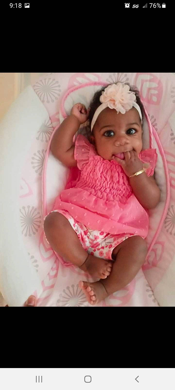 Jeliyah is registered to the contest to win money with this photo: arm, baby, baby_toddler_clothing, cheek, child, clothing, comfort, dress, embellishment, eyelash, happy, headgear, headwear, human_body, lip, magenta, person, pink, skin, sleeve