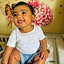 Sierra is registered to the contest to win money with this photo: baby, changing_pad, child, curly_hair, cute, denim_shorts, fairy, flowers, hair_buns, hand, happy, indoor, infant, nursery, person, sitting, skin, smiling, wall_decals, white_shirt