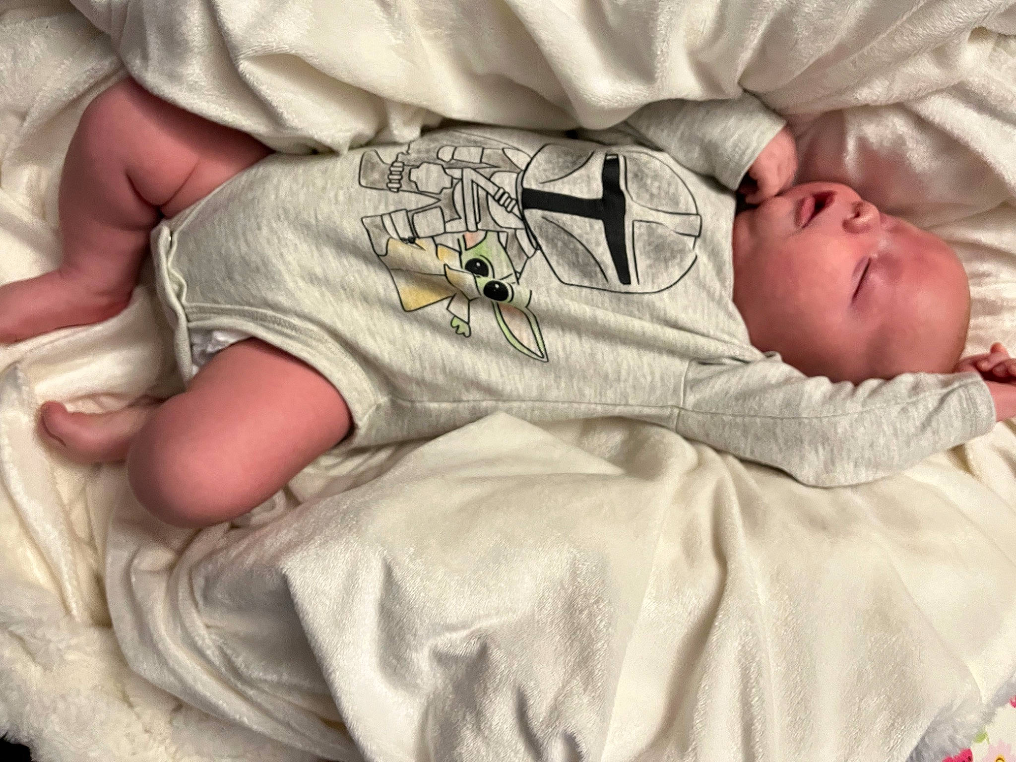Cyrus is registered to the contest to win money with this photo: baby, baby_products, baby_sleeping, baby_toddler_clothing, bed, bedding, child, comfort, finger, gesture, hand, human_body, human_leg, leg, linens, person, skin, sleeve, textile, toddler