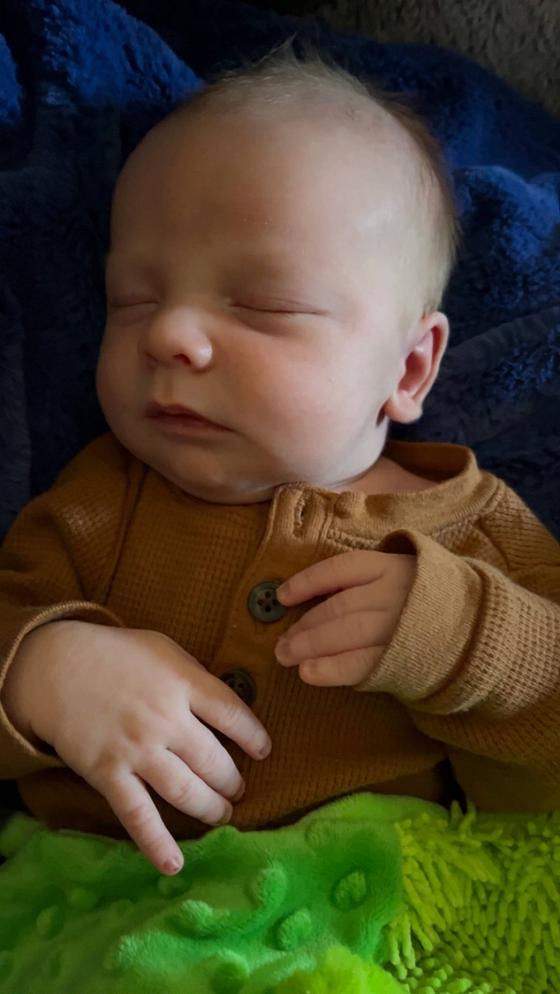 Cyrus joined the competition — help win amazing prizes! baby, baby_toddler_clothing, blue, cheek, chin, clothing, eye, facial_expression, finger, gesture, green, hand, human, human_body, iris, lip, mouth, nose, person, skin