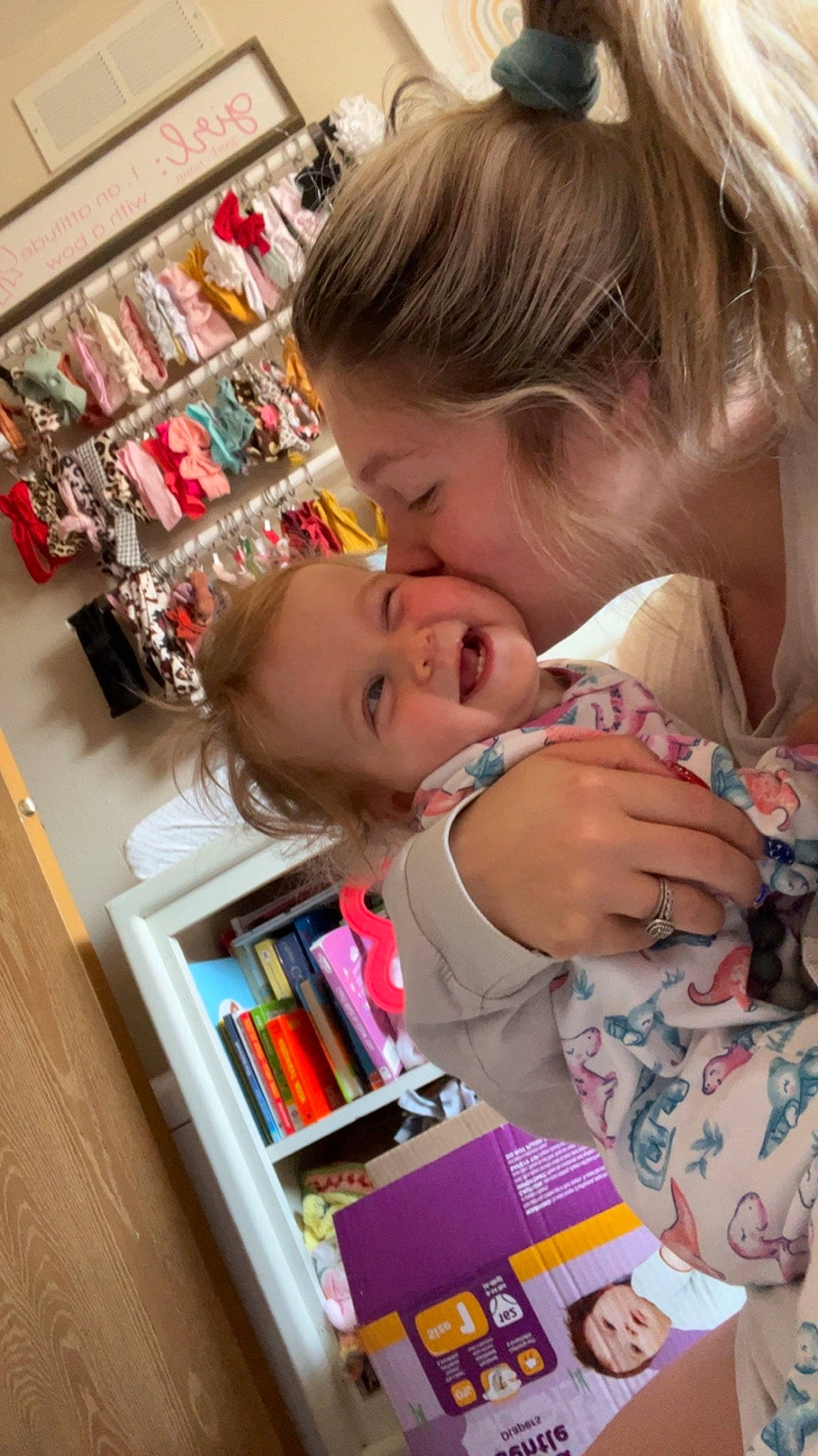 Hallie joined the competition — help win amazing prizes! baby, baby_products, book, bookcase, cheek, child, ear, eyelash, fun, happy, iris, person, play, product, publication, room, shelf, shelving, skin, smile