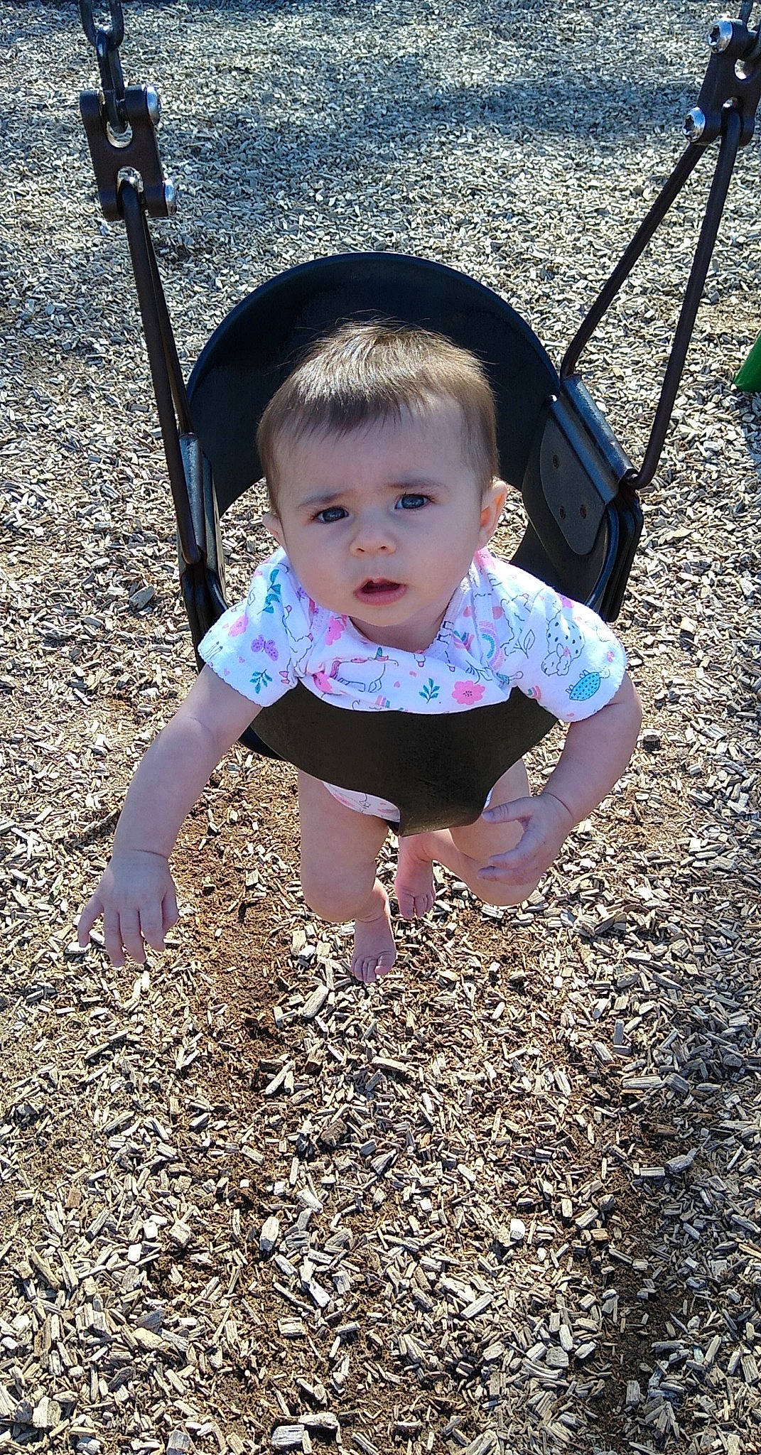 Olivia is registered to the contest to win money with this photo: baby, baby_products, baby_toddler_clothing, child, city, foot, fun, grass, happy, leisure, pattern, people_in_nature, person, play, recreation, shadow, sitting, smile, soil, toddler