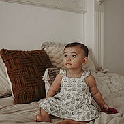 Alessa joined the competition — help win amazing prizes! toddler, child, baby, dress, bed, pillow, indoors, curly_hair, sitting, looking_up, cute, soft_light, home, cozy, infant, person, furniture, skin, barefoot, toy