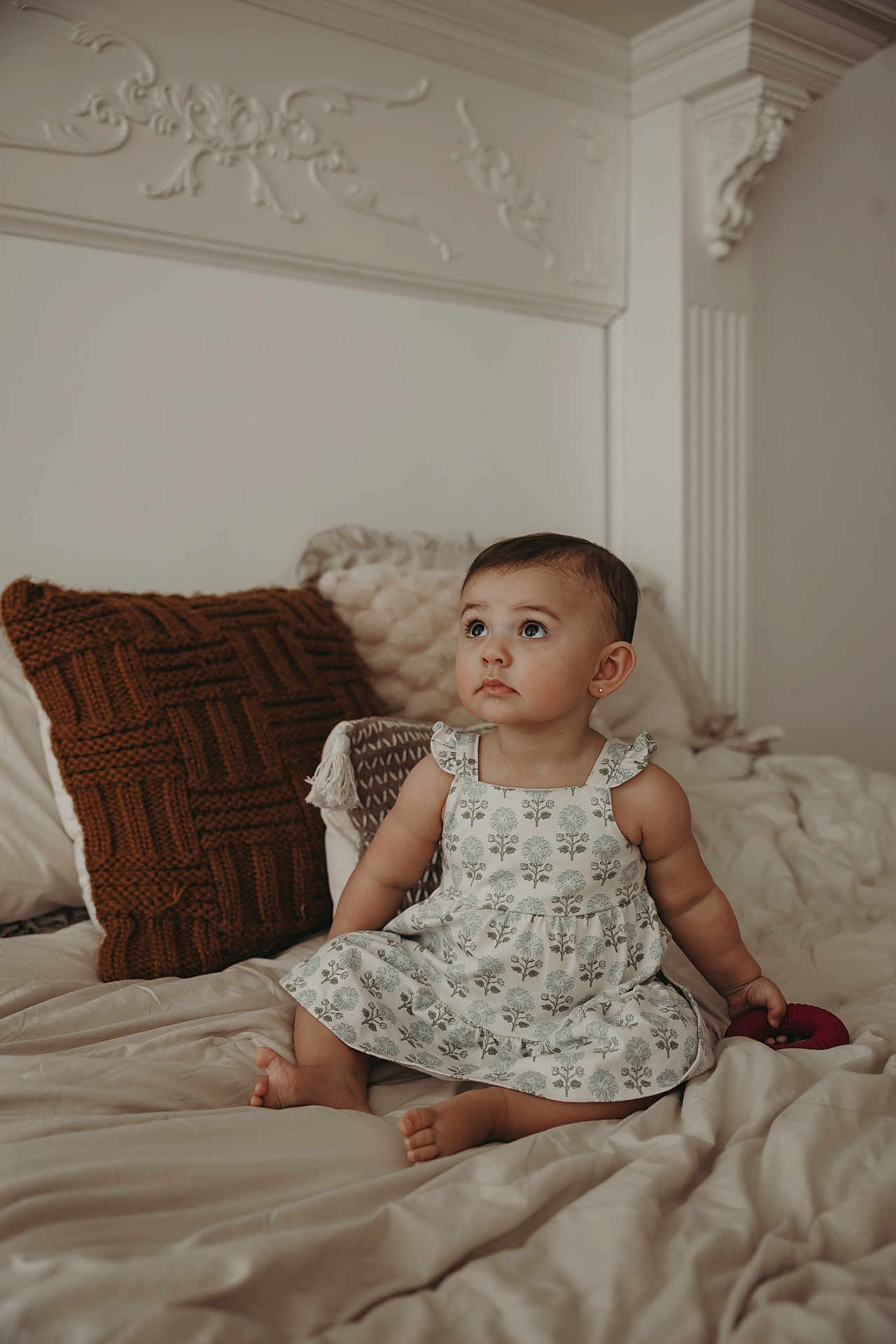 Alessa joined the competition — help win amazing prizes! toddler, child, baby, dress, bed, pillow, indoors, curly_hair, sitting, looking_up, cute, soft_light, home, cozy, infant, person, furniture, skin, barefoot, toy