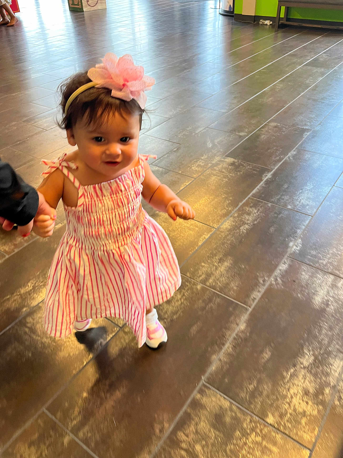 Arabella joined the competition — help win amazing prizes! toddler, child, girl, dress, headband, flower, walking, indoor, floor, tile, hand, support, cute, pink, white, shoes, person, baby, smile, young