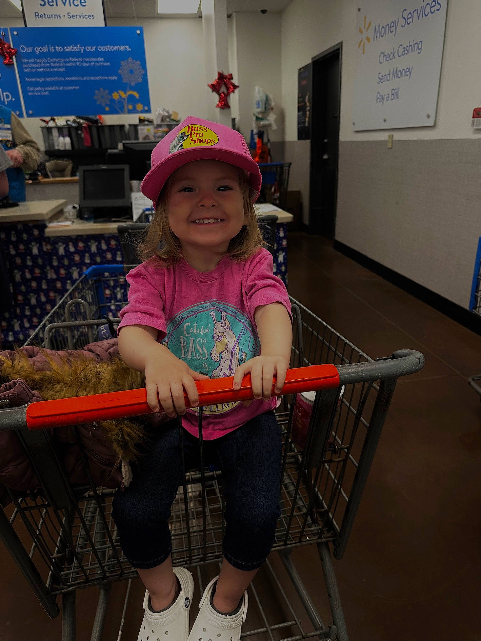Aeverie is registered to the contest to win money with this photo: baby_toddler_clothing, cart, child, fun, happy, hat, headwear, human_leg, joy, knee, leisure, magenta, person, play, shelf, shorts, smile, t_shirt, thigh, tire