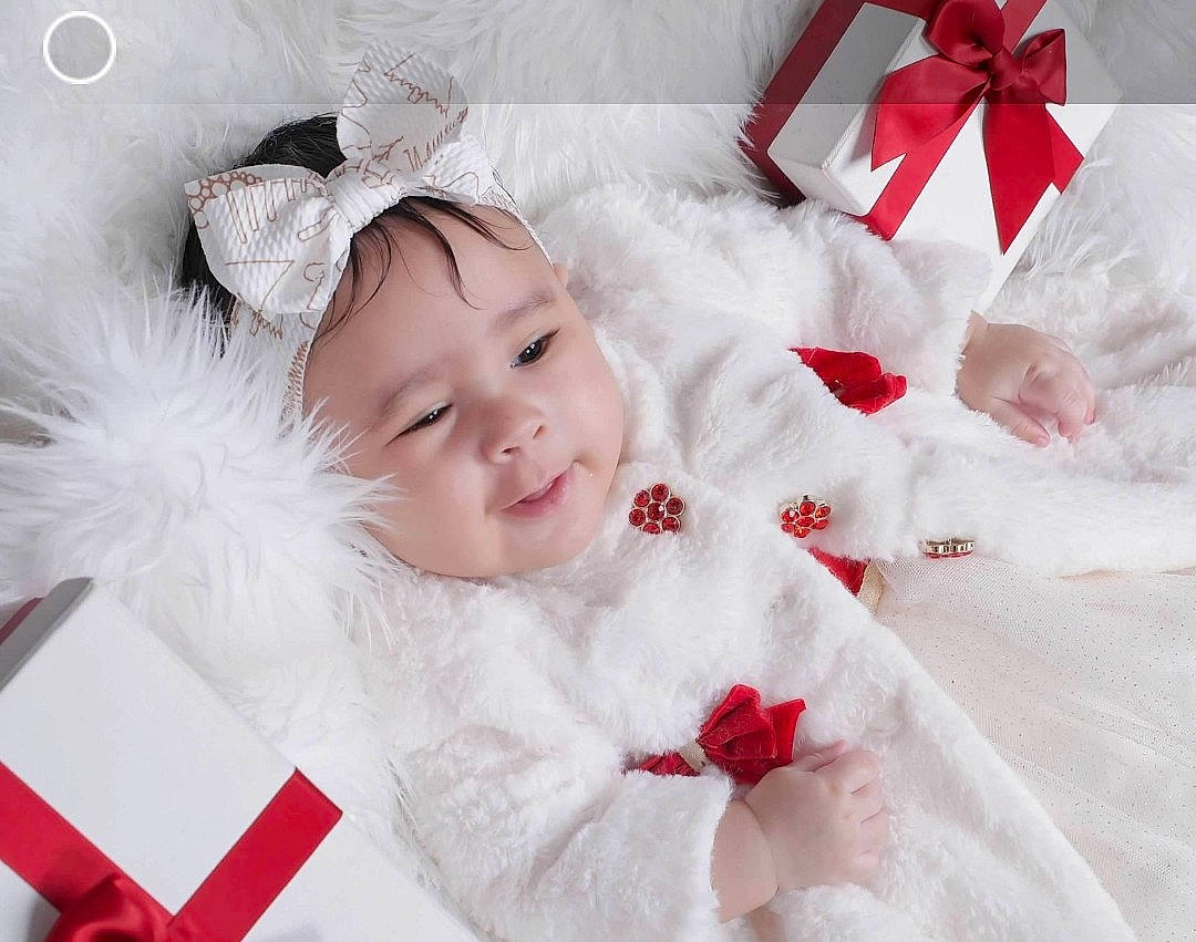 Trinity joined the competition — help win amazing prizes! baby, baby_toddler_clothing, carmine, child, costume_hat, event, face, facial_expression, fur, happy, headwear, holiday, person, petal, pink, red, skin, sleeve, smile, textile