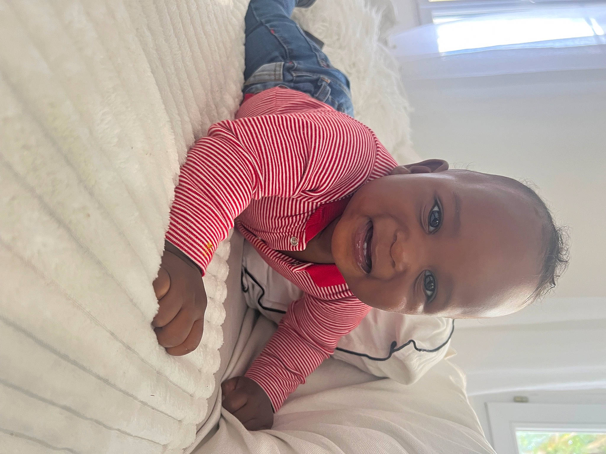 Kyron participe au concours pour gagner de l'argent avec cette photo : baby, baby_toddler_clothing, child, comfort, dress, elbow, flooring, fun, happy, hat, mouth, nose, pattern, person, plant, shoulder, skin, sleeve, smile, toddler