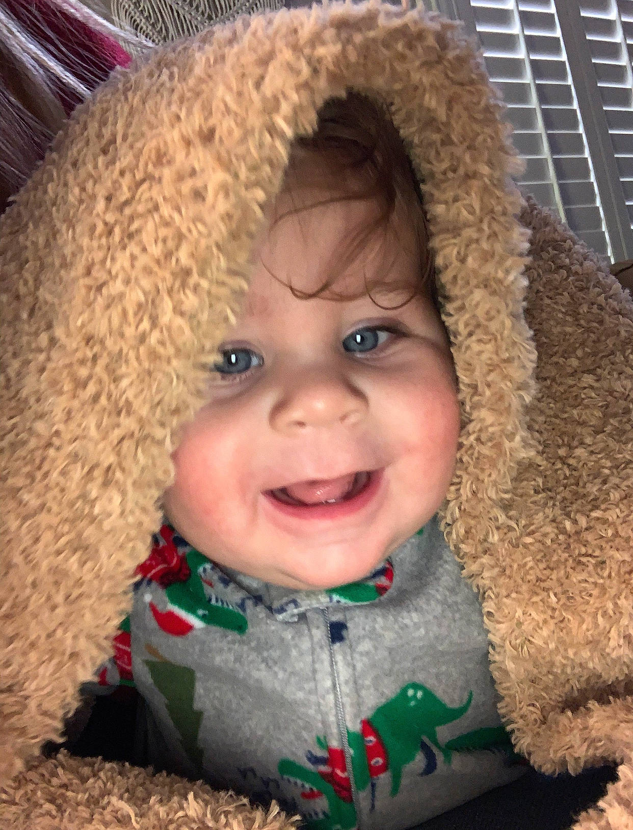 Cruz is registered to the contest to win money with this photo: baby, baby_laughing, baby_toddler_clothing, brown_hair, cheek, child, costume_accessory, eye, headwear, humour, iris, joy, laugh, person, pleased, plush, ringlet, stuffed_toy, textile, toddler