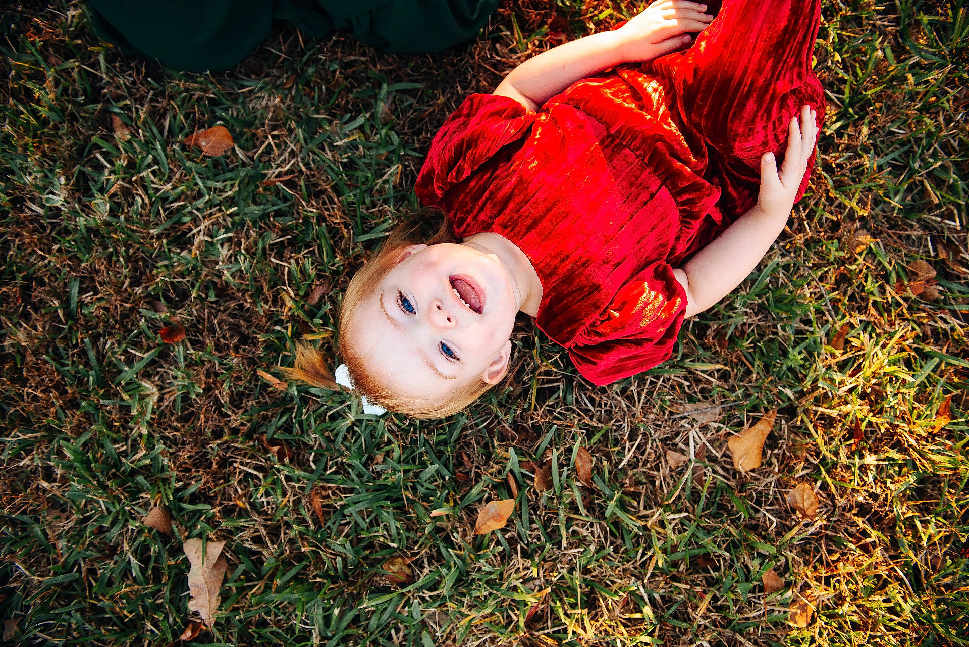 Kamryn is registered to the contest to win money with this photo: baby, bodypart, clothing, dress, eveningdress, face, fashion, finger, formalwear, gown, grass, hand, happy, head, person, photography, plant, portrait, smile, velvet