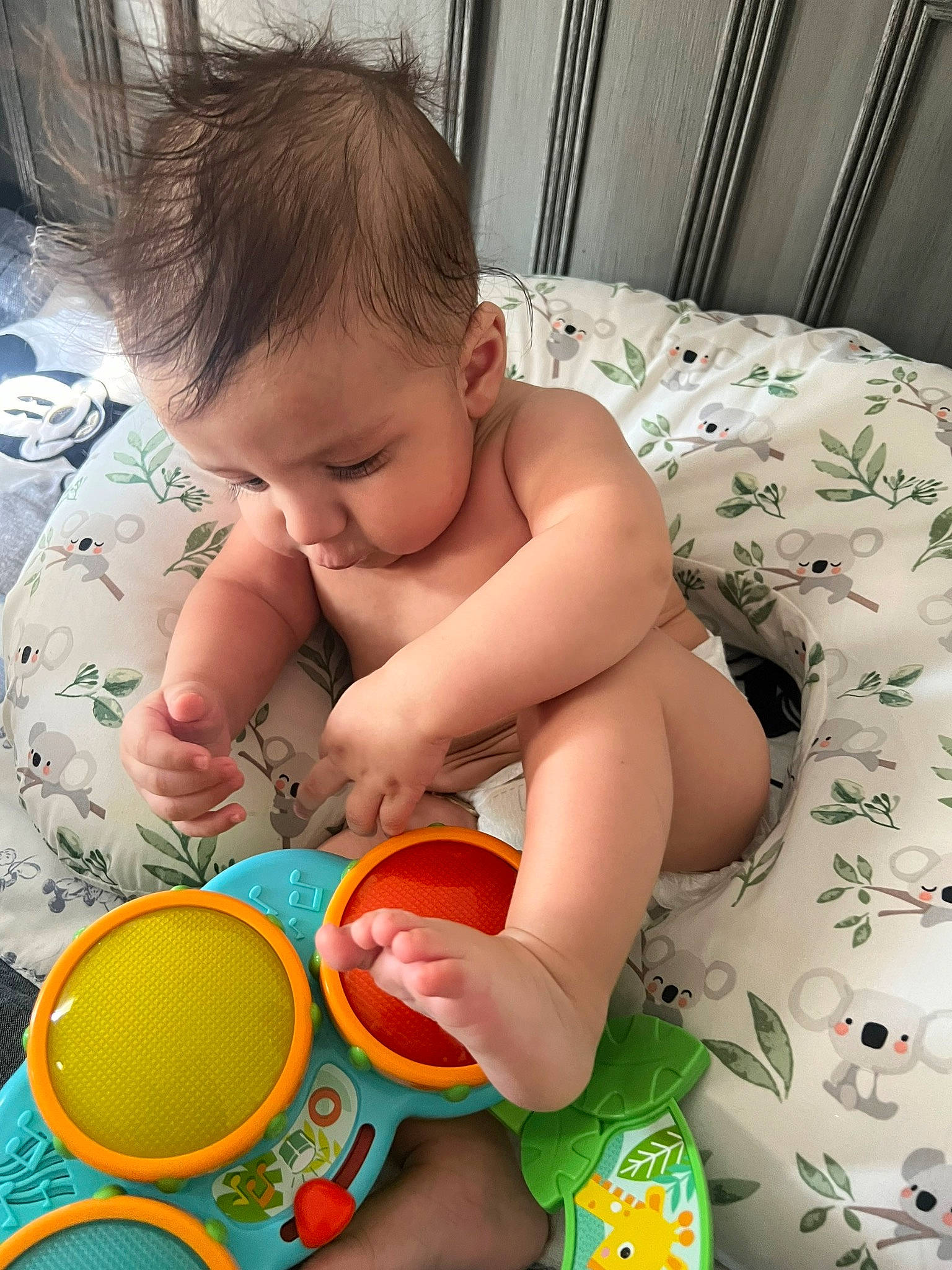 David is registered to the contest to win money with this photo: baby, baby_playing_with_toys, baby_products, baby_toddler_clothing, baby_toys, bathing, child, comfort, drinkware, finger, fun, happy, musical_instrument, person, plastic, play, room, sitting, skin, toddler