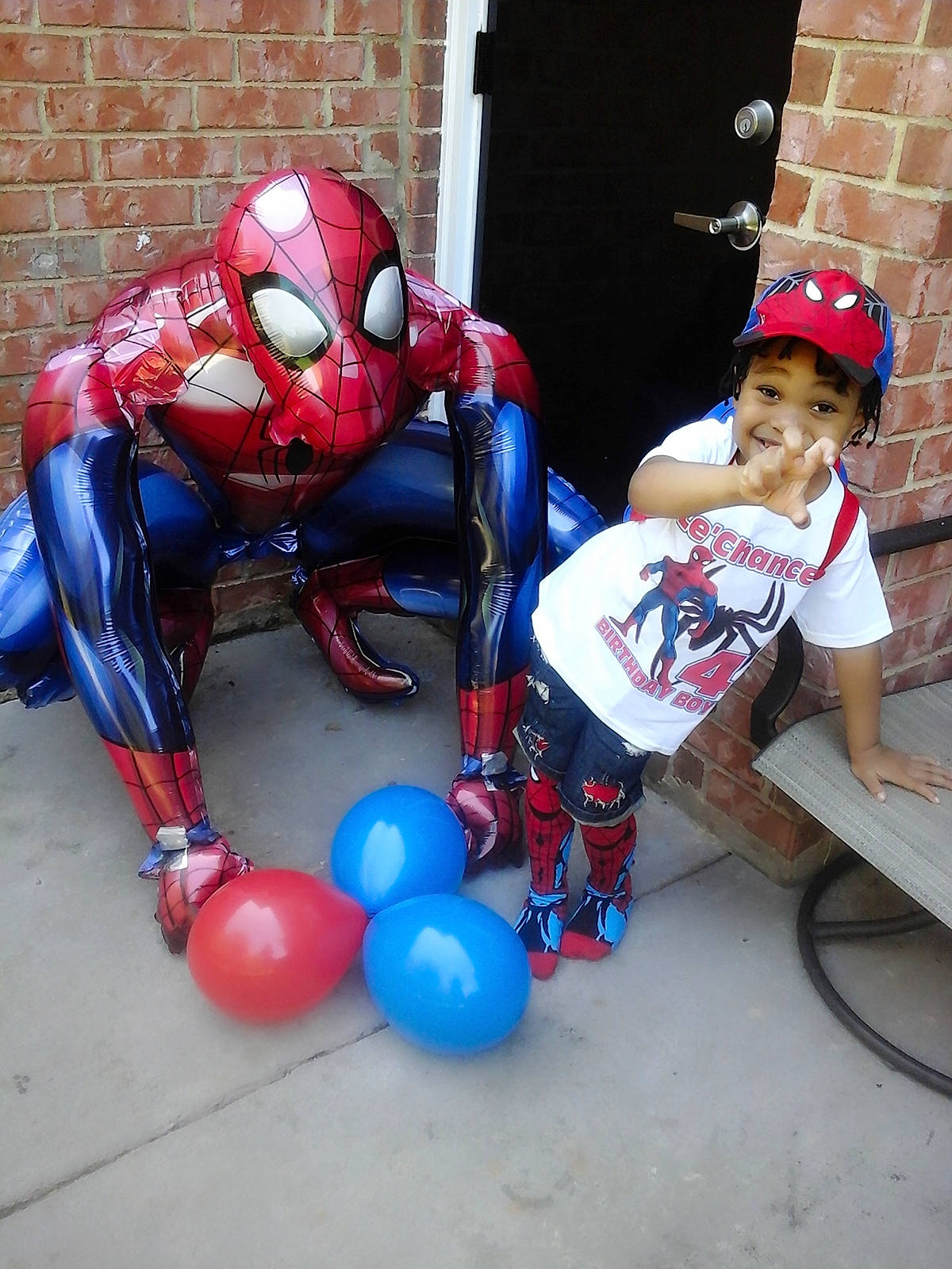 Le' Chance is registered to the contest to win money with this photo: balloon, fictional_character, headwear, joy, party_supply, person, spider_man, superhero, toy