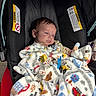 Ryker joined the competition — help win amazing prizes! baby, blanket, buckle, car_seat, cozy, fabric, hair, hand, head, infant, pacifier, pacifier_clip, patterned_blanket, person, portrait, red, seat, sleepy, stroller, warning_label