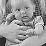 baby, infant, black_and_white, hand, tattoo, person, cute, portrait, child, holding, face, eyes, hair, skin, clothing, adult, arm, expression, closeup, toddler