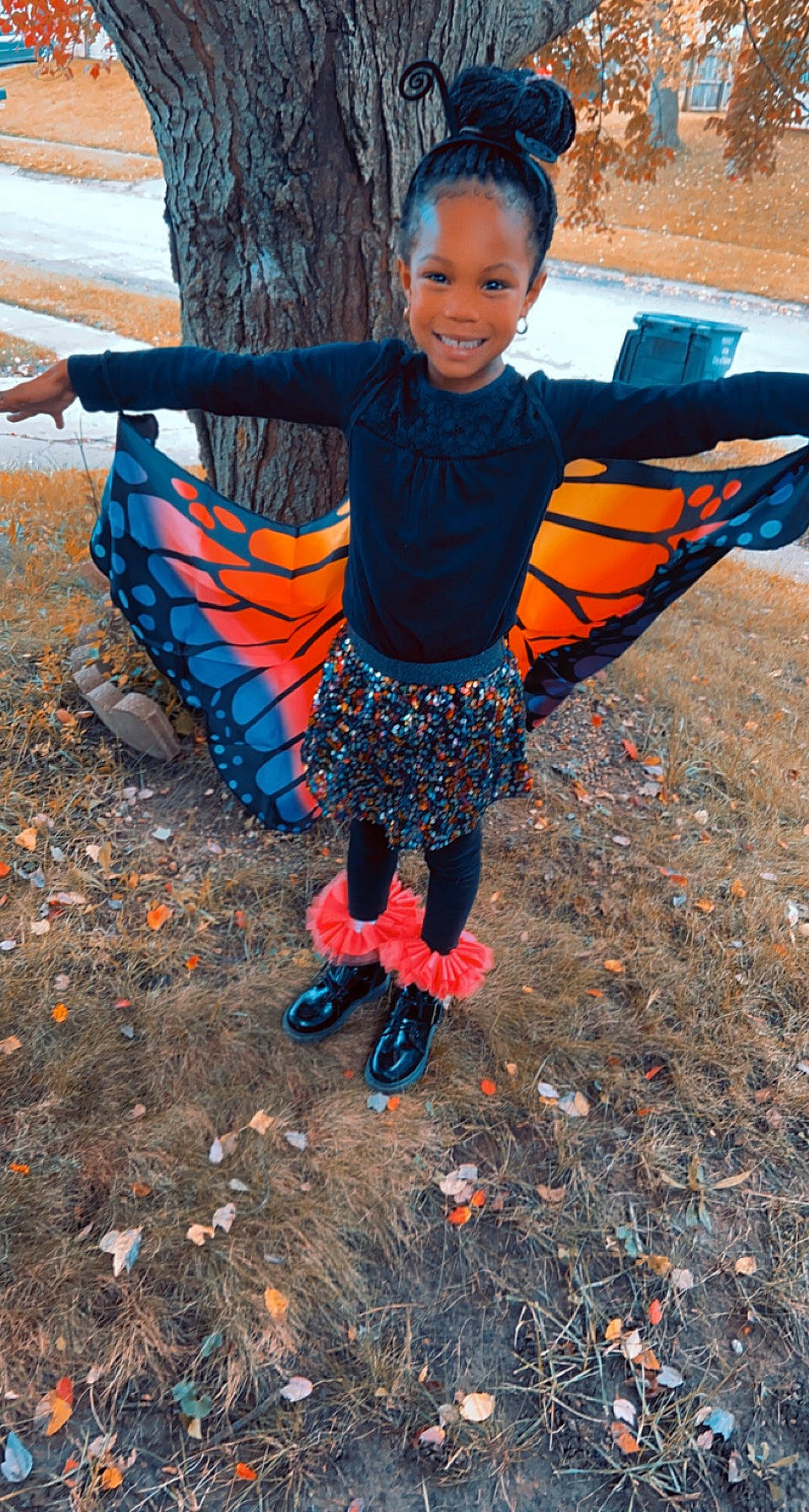 Kaeleigh is registered to the contest to win money with this photo: child, deciduous, electric_blue, eye, fun, happy, joy, leaf, leisure, orange, pattern, people_in_nature, person, recreation, sitting, smile, soil, tints_and_shades, toddler, travel