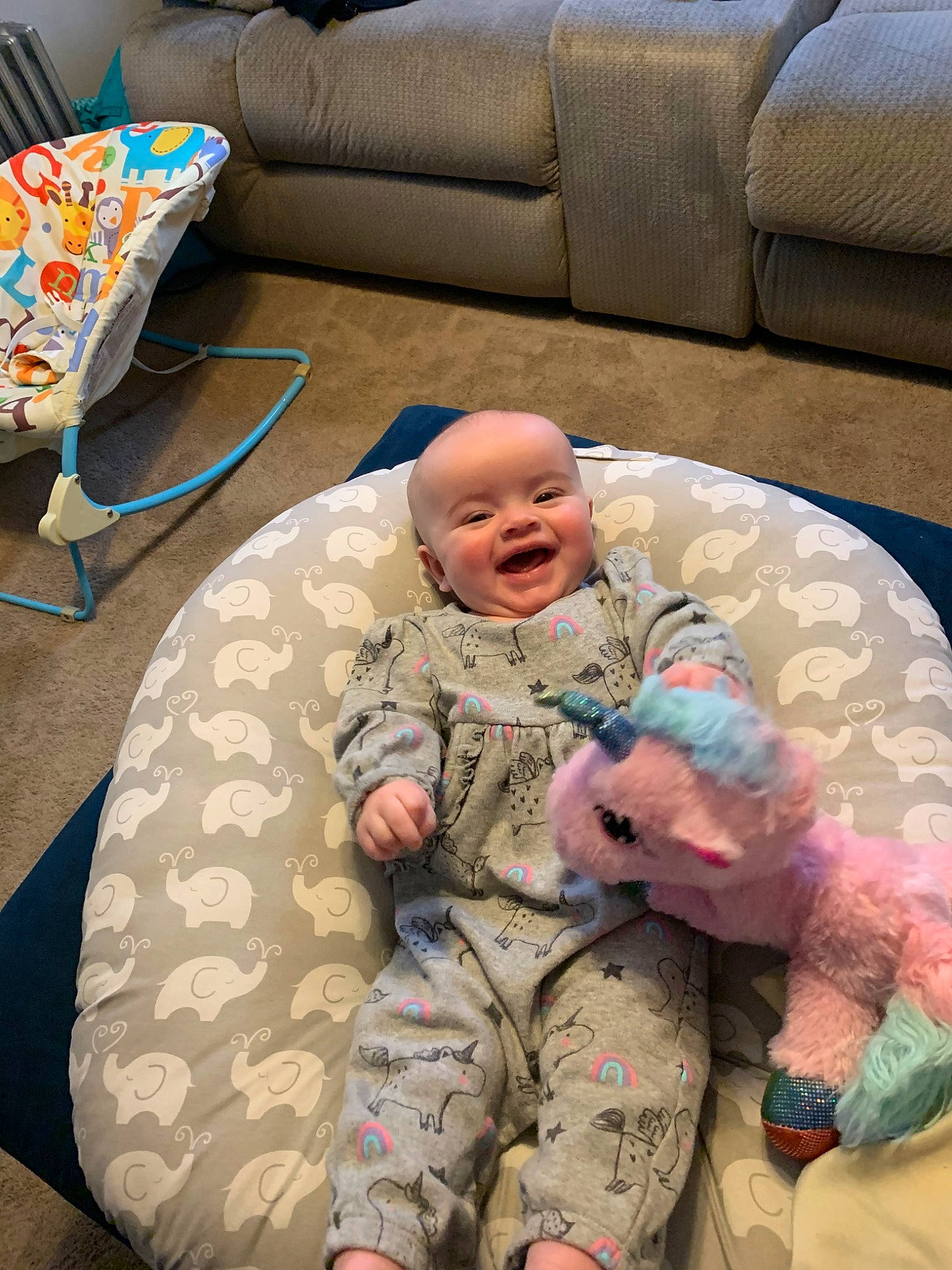 Zia is registered to the contest to win money with this photo: army, baby, child, comfort, couch, military, military_camouflage, military_uniform, person, sitting, soldier, toddler