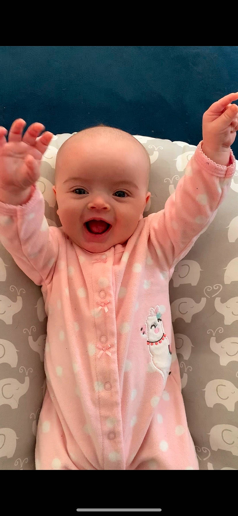 Zia is registered to the contest to win money with this photo: baby, baby_making_funny_faces, cheek, child, ear, face, facial_expression, finger, forehead, gesture, head, lip, mouth, nose, person, pink, skin, smile, toddler