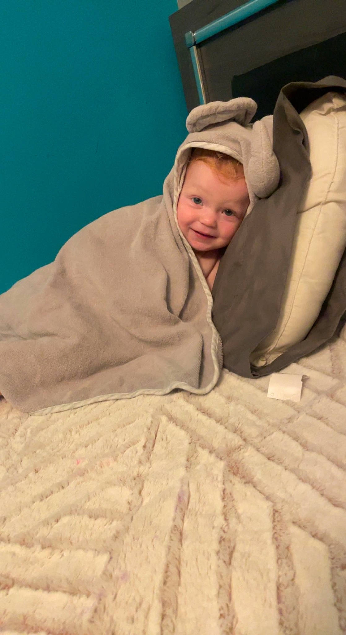 Alayna joined the competition — help win amazing prizes! baby, bedding, cap, child, comfort, fur, happy, hoodie, joy, landscape, linens, person, room, sand, sitting, sleeve, smile, toddler