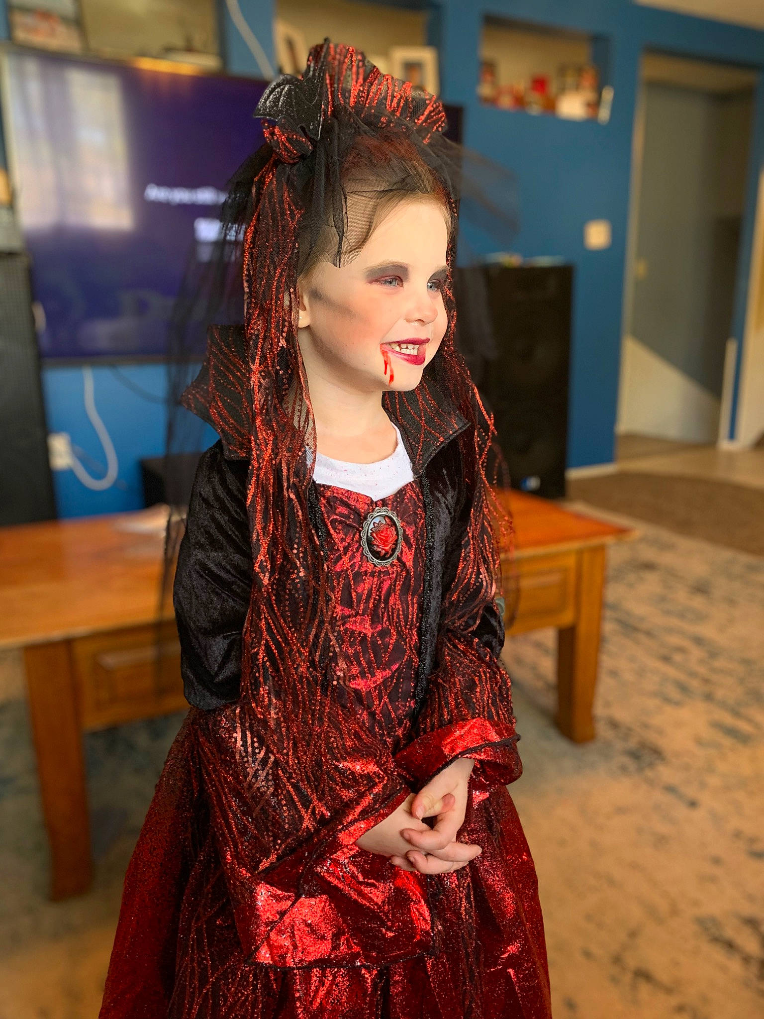 Magnolia is registered to the contest to win money with this photo: brown_hair, dress, event, eyewear, fashion, fashion_accessory, fashion_design, flooring, formal_wear, fun, hairstyle, happy, headpiece, jewellery, makeover, pattern, person, smile, table, toy