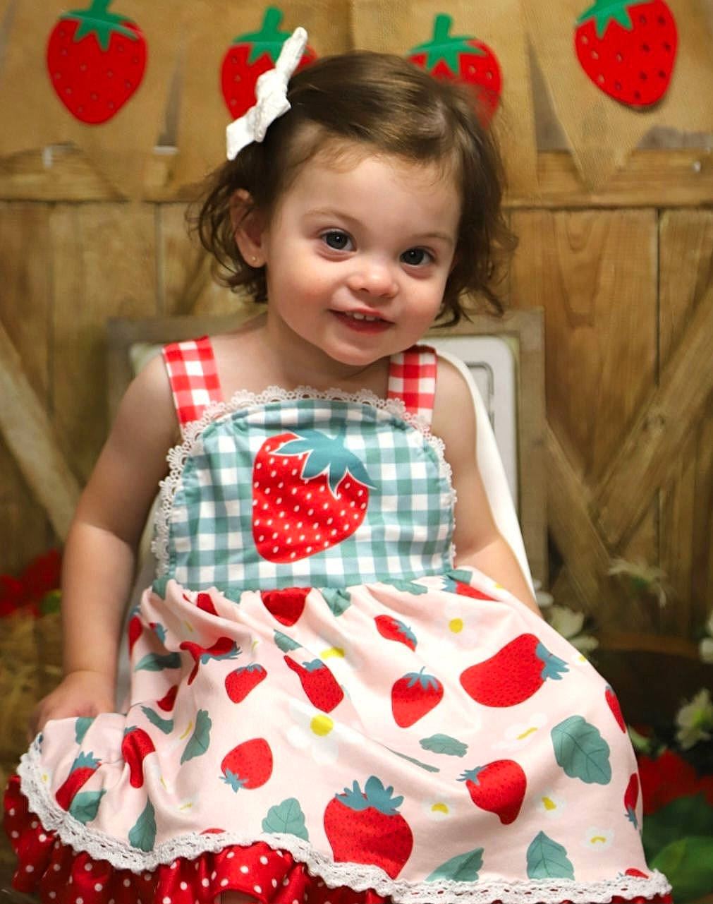 Carlee joined the competition — help win amazing prizes! baby_toddler_clothing, child, dance, day_dress, dress, embellishment, entertainment, event, fashion_design, green, happy, joy, one_piece_garment, pattern, person, pink, red, sitting, sleeve, smile