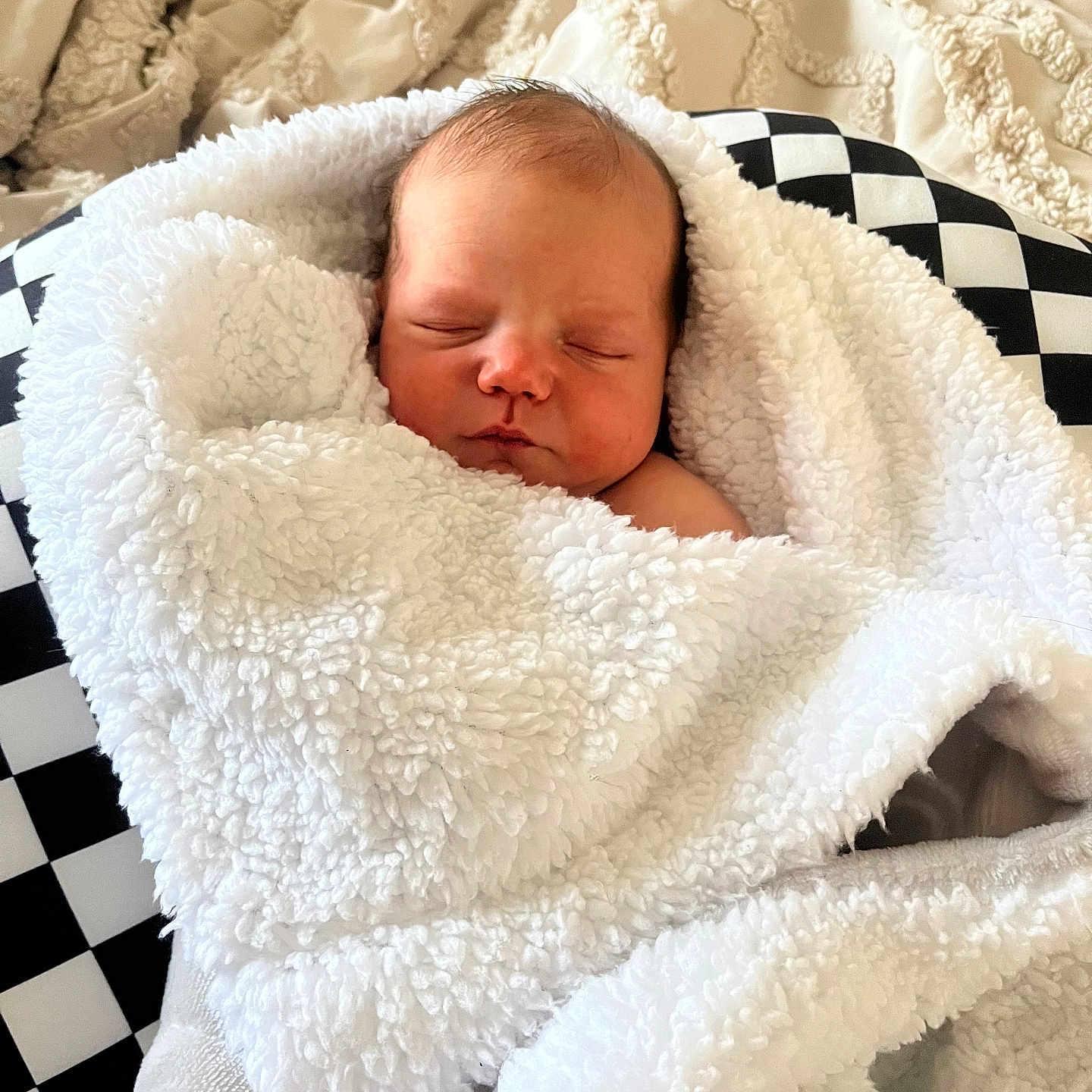 Asher is registered to the contest to win money with this photo: baby, blanket, crib, face, furniture, head, infantbed, newborn, person, photography, portrait, quilt, sleeping, towel