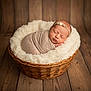 Makenzie is registered to the contest to win money with this photo: newborn, baby, infant, swaddled, basket, wicker, blanket, faux_fur, headband, flower_headband, sleeping, peaceful, portrait, studio_lighting, wooden_floor, soft_texture, closeup, cute, prop_photography, lace_wrap
