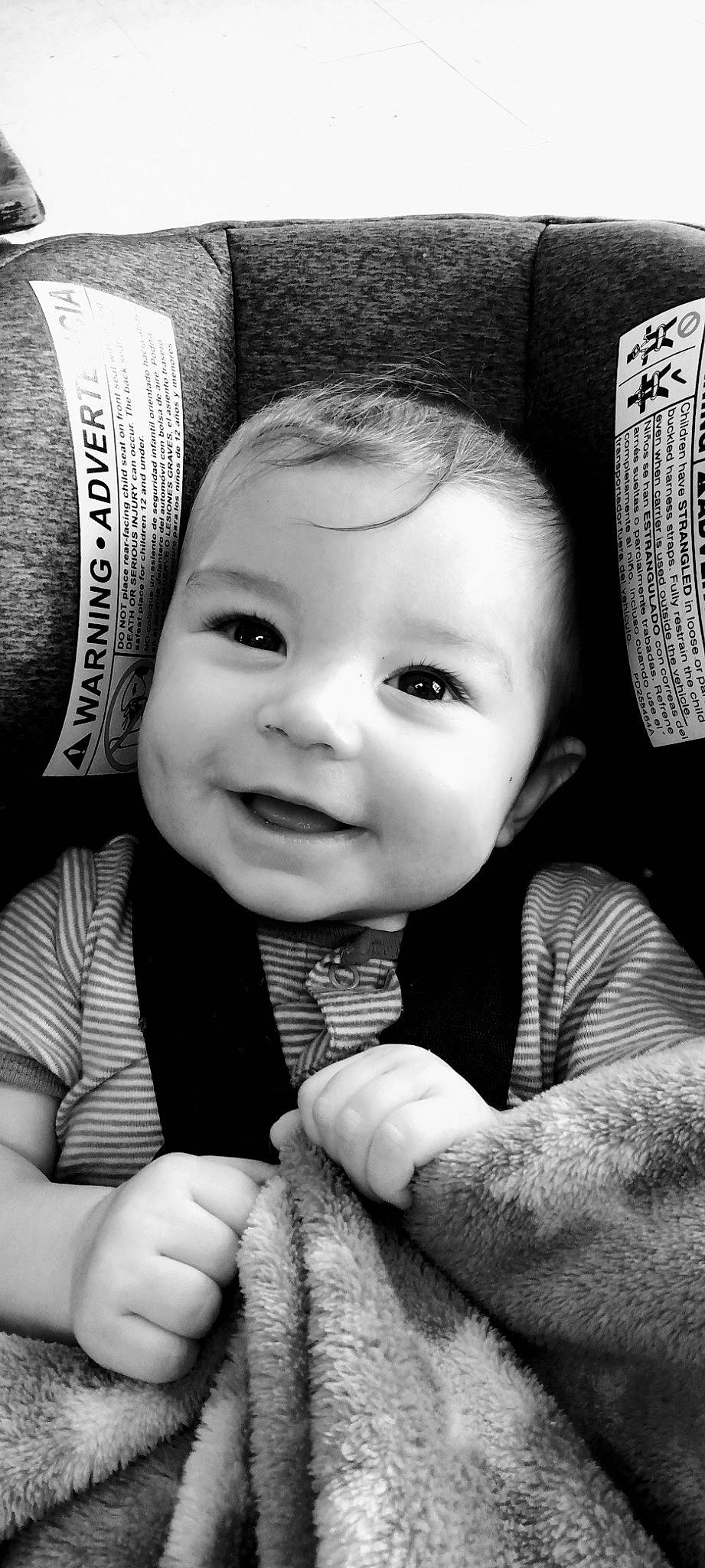 Jamison is registered to the contest to win money with this photo: arm, black, cheek, chin, eye, face, facial_expression, hairstyle, hand, head, human, joy, lip, mouth, nose, organ, person, photograph, product, skin