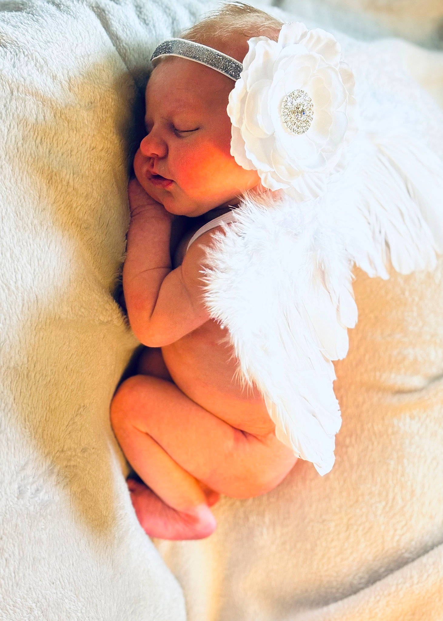 Gemma joined the competition — help win amazing prizes! abdomen, arm, baby, baby_sleeping, child, comfort, dress, eye, face, feather, finger, gesture, head, headgear, human_body, linens, nail, person, petal, thumb