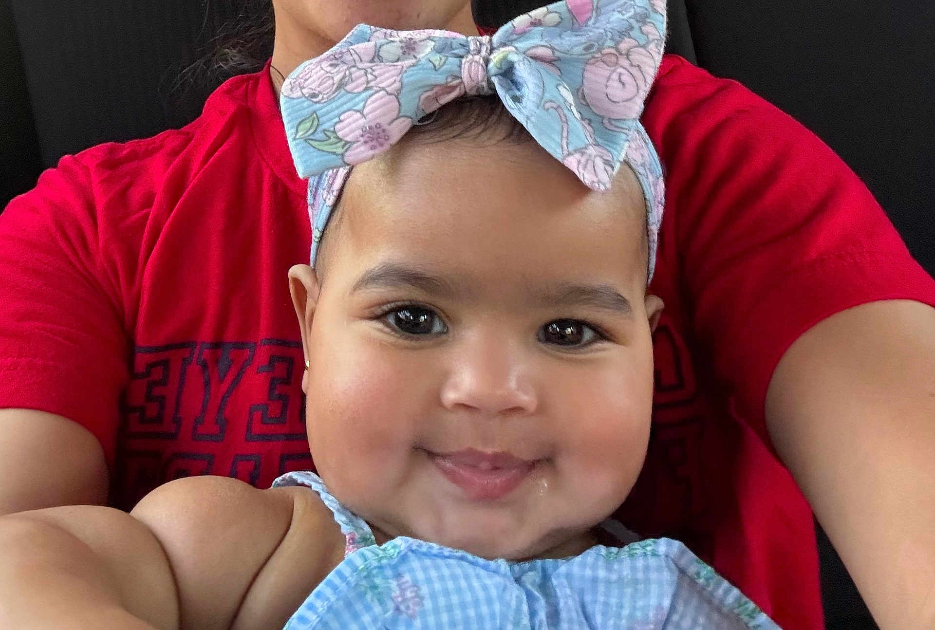 Myah joined the competition — help win amazing prizes! baby, child, smiling, headband, bow, closeup, face, cheeks, person, red_shirt, clothing, skin, portrait, cute, happy, indoor, infant, young_child, fashion, headwear