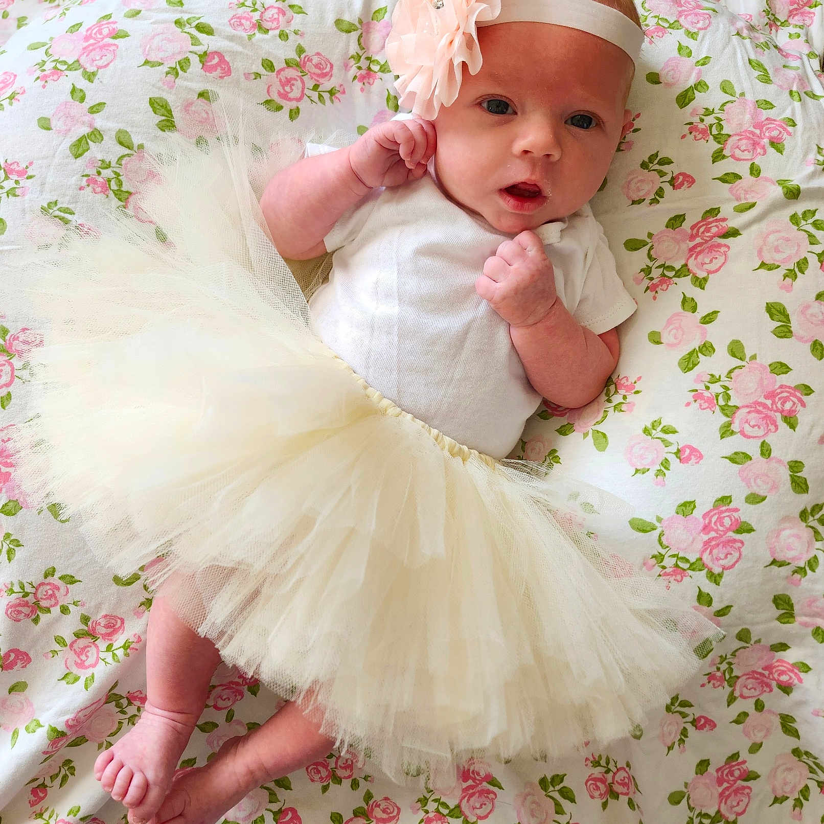 Claire is registered to the contest to win money with this photo: accessories, baby, bed, bodypart, clothing, costume, cushion, dress, face, finger, flower, formalwear, furniture, hand, head, homedecor, newborn, person, photography, portrait