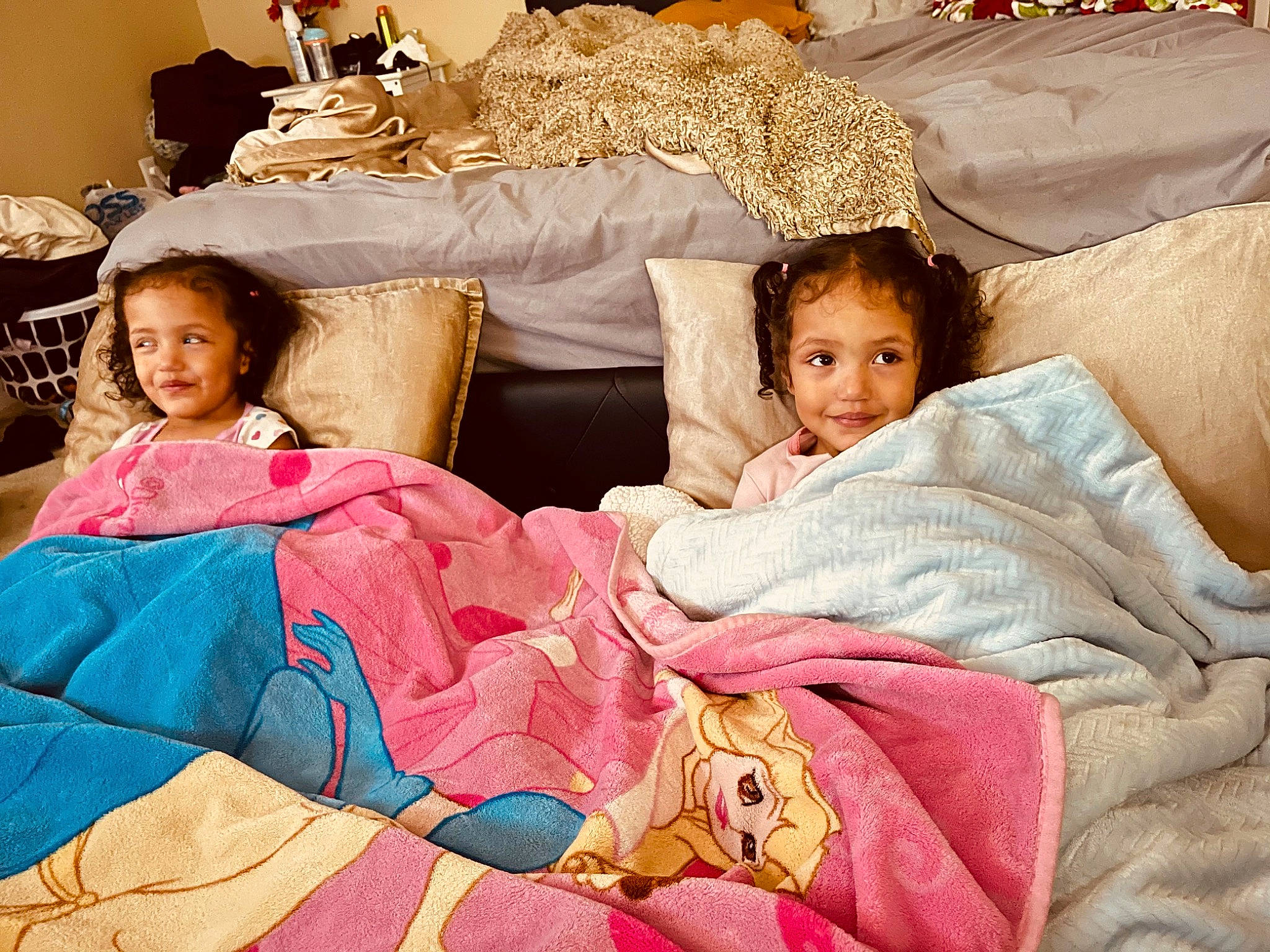 Irianny is registered to the contest to win money with this photo: bed, bed_sheet, bedding, bedroom, child, comfort, couch, event, facial_expression, fun, hairstyle, happy, joy, linens, people, person, pillow, pink, skin, textile