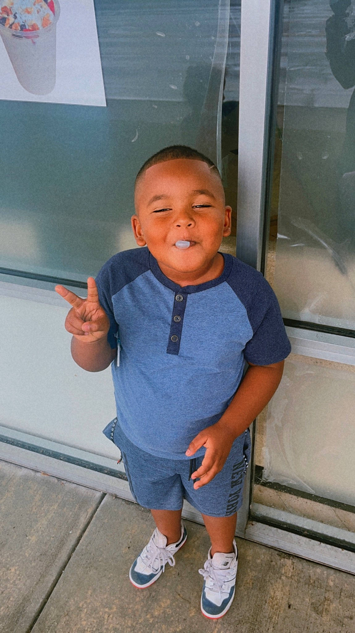 Jayko is registered to the contest to win money with this photo: baby_toddler_clothing, child, electric_blue, fun, gas, happy, leisure, person, room, sandal, shorts, sleeve, smile, sock, standing, t_shirt, thumb, toddler, vacation, vehicle_door