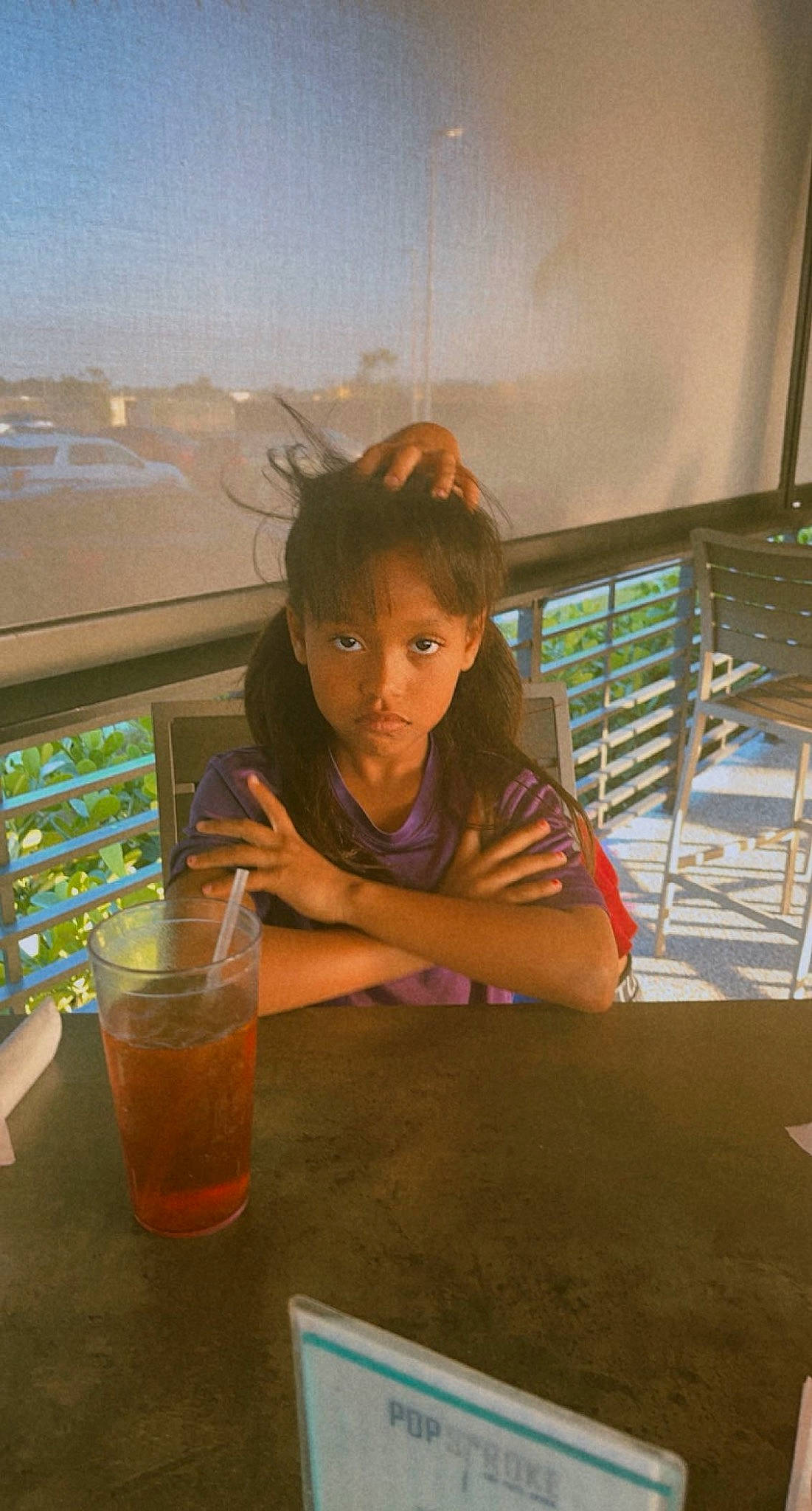 Amani joined the competition — help win amazing prizes! alcoholic_beverage, chair, classic_cocktail, cocktail, desk, distilled_beverage, drink, drinking_straw, drinkware, fun, glass, juice, leisure, long_island_iced_tea, person, sitting, soft_drink, t_shirt, table, tableware