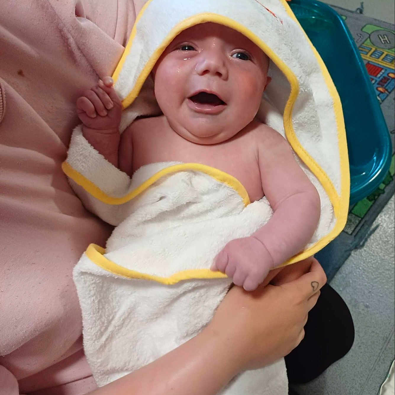 Brandon Lee Jnr is registered to the contest to win money with this photo: baby, care, child, cute, expression, hand, happy, holding, indoor, infant, parent, person, pink_sleeve, play_mat, skin, smiling, towel, toys, wrapped, young