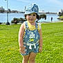 beachwear, cap, child, clothing, face, female, girl, grass, hat, head, nature, outdoors, park, person, photography, plant, portrait, shorts, summer, water