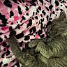 cat, sleeping, fluffy, gray_fur, pet, animal, curled_up, nap, blanket, pink, black, spotted, cozy, indoors, resting, furry, whiskers, paws, closeup, relaxed