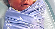 Tylee joined the competition — help win amazing prizes! baby, blanket, child, closeup, cute, face, indoors, infant, newborn, peaceful, person, portrait, purple, resting, sleep, sleeping, soft, swaddled, white, wrapped