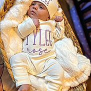 Tylee is registered to the contest to win money with this photo: baby, infant, basket, blanket, clothing, hat, pajamas, newborn, cute, cozy, sleepwear, soft, face, person, portrait, resting, indoor, warm, fingers, foot