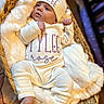 baby, infant, basket, blanket, clothing, hat, pajamas, newborn, cute, cozy, sleepwear, soft, face, person, portrait, resting, indoor, warm, fingers, foot