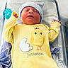 Tylee joined the competition — help win amazing prizes! newborn, baby, infant, yellow_clothing, hat, pacifier, hospital_bassinet, sleeping, cute, child, face, portrait, soft_light, blanket, resting, small_hands, baby_girl, baby_boy, cozy, newborn_clothes