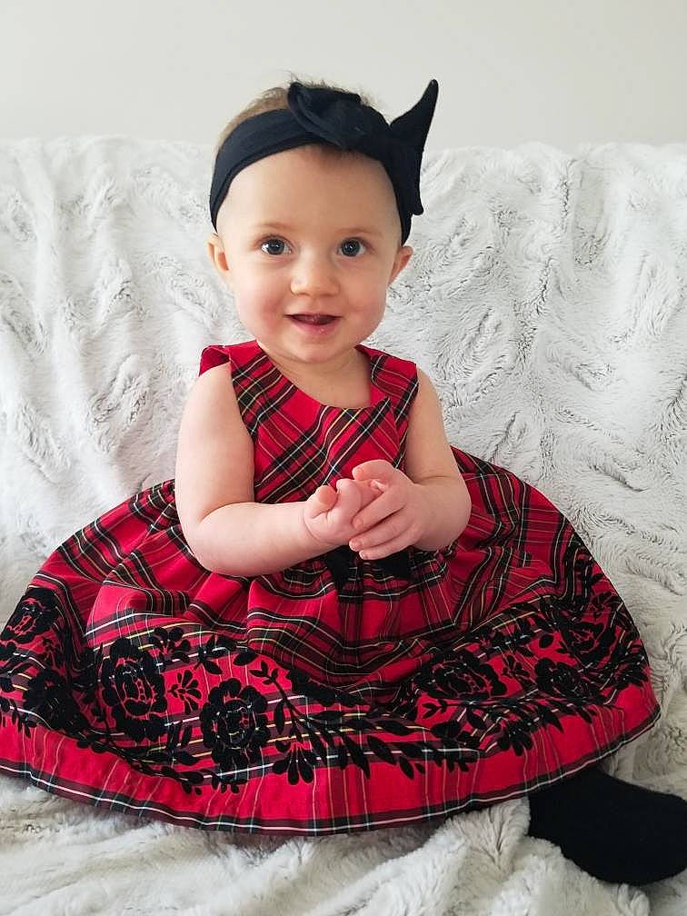 Isla joined the competition — help win amazing prizes! baby_toddler_clothing, child, collar, day_dress, dress, embellishment, fashion_accessory, flash_photography, happy, headwear, joy, magenta, neck, outerwear, pattern, person, pink, red, sitting, sleeve