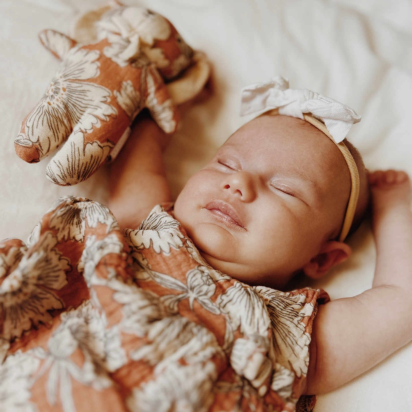 Adah joined the competition — help win amazing prizes! baby, blanket, bow, child, comfort, cute, dress, face, floral_pattern, hand, headband, indoors, infant, peaceful, resting, skin, sleeping, soft, stuffed_toy, toy