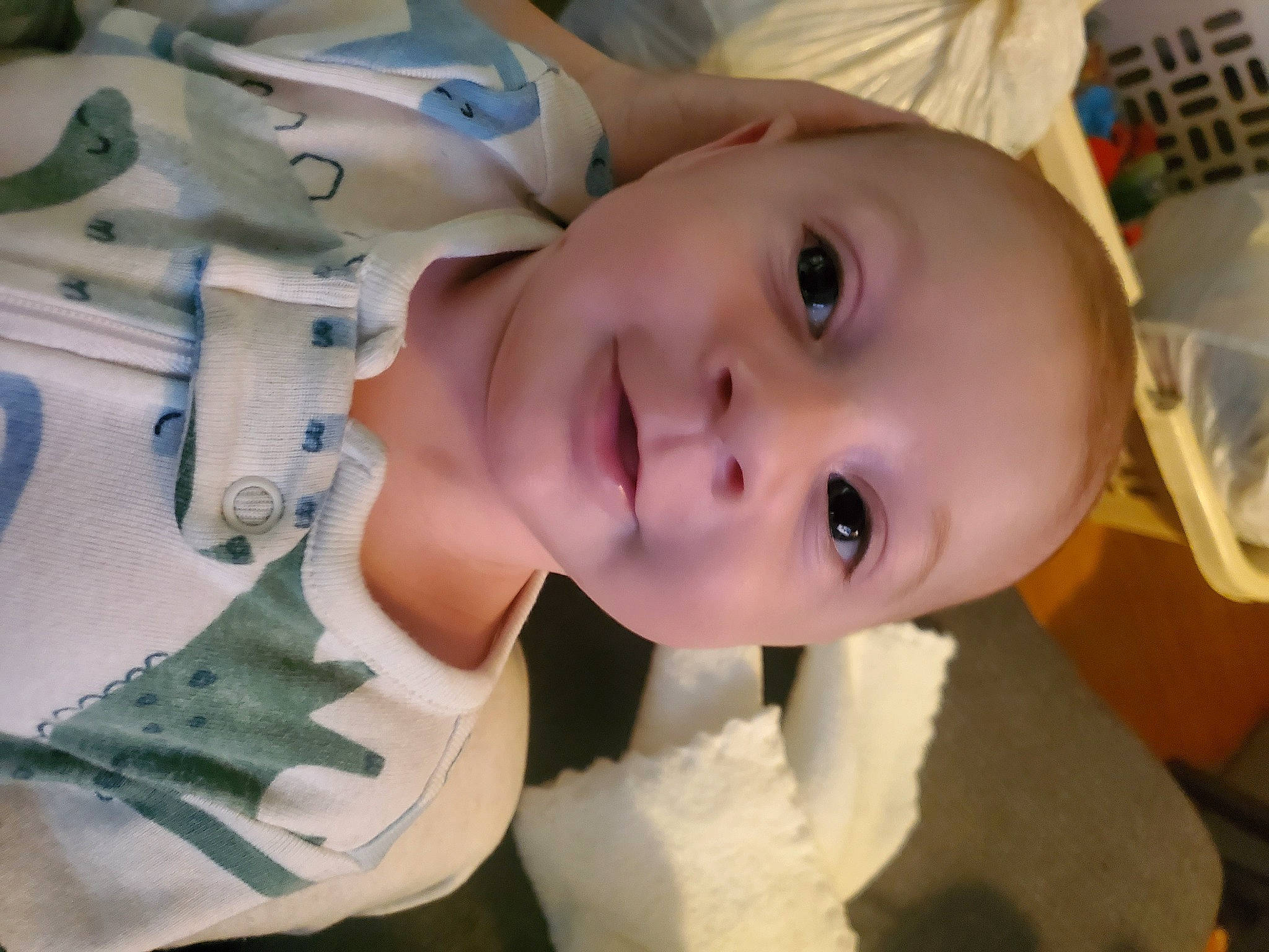 Atticus is registered to the contest to win money with this photo: baby, baby_products, baby_toddler_clothing, cheek, child, chin, eye, eyebrow, eyelash, fun, happy, iris, lip, mouth, nose, person, room, skin, sleeve, smile