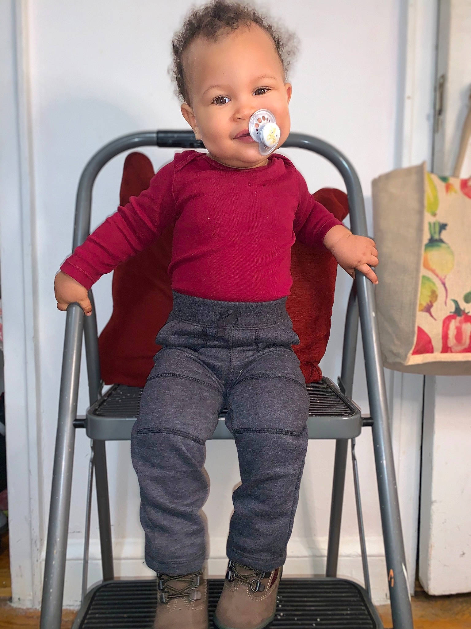 Jared is registered to the contest to win money with this photo: art, baby, baby_toddler_clothing, chair, child, denim, easel, electric_blue, head, joint, knee, magenta, pattern, person, room, sitting, sleeve, t_shirt, toddler